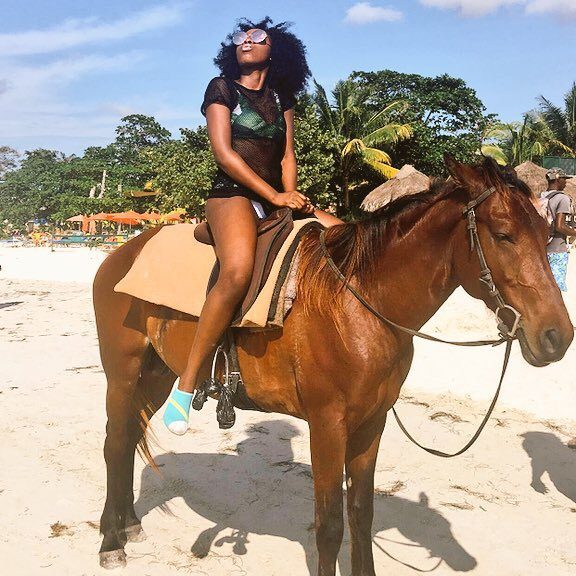 Jamaica Travel Guide:
Top Things To Do, Eat and See: A girl on horse at Montego Bay margarittaville beach