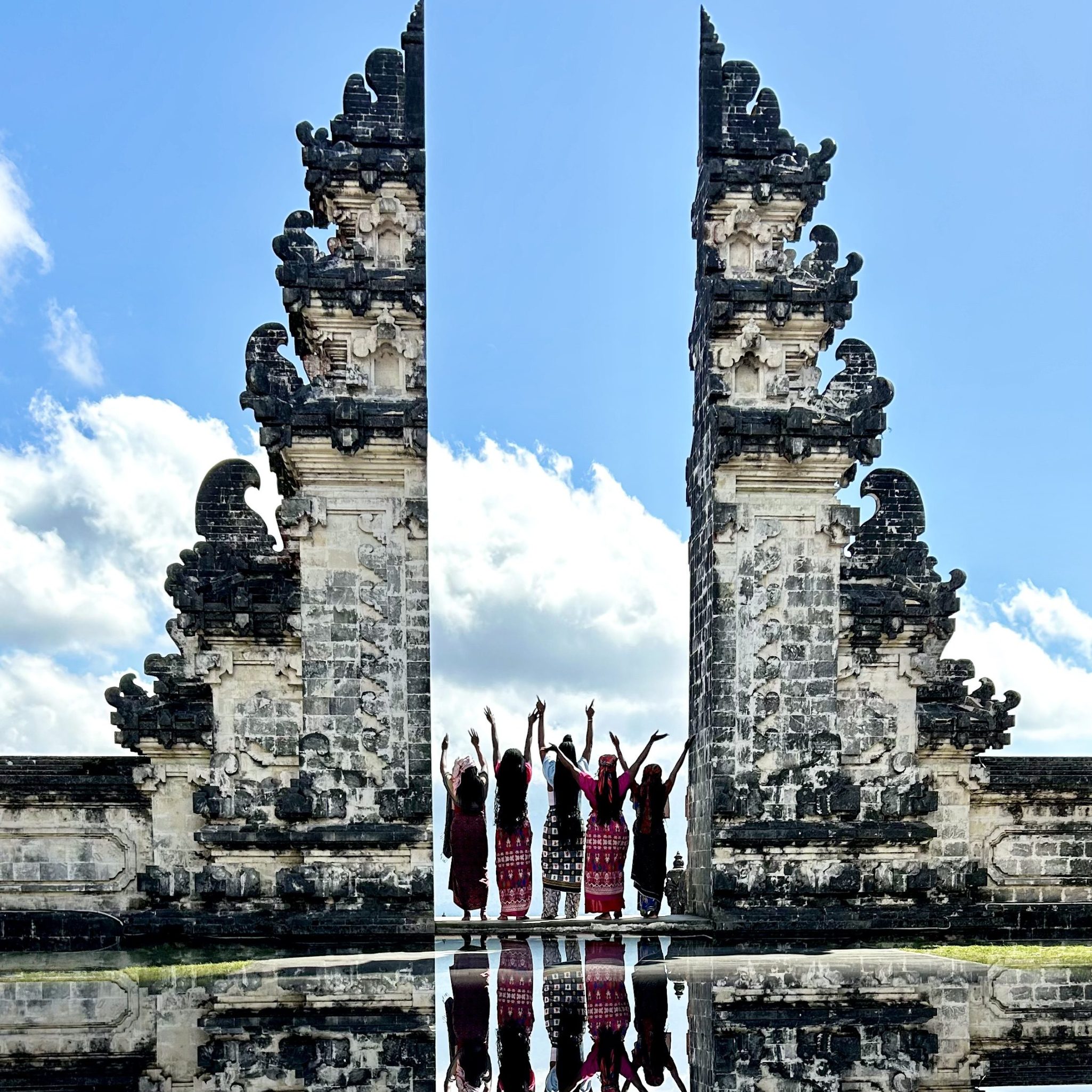 girls raising hands at bali heaven's gate Bali