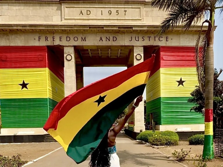 Detty December 2025 party in Lagos, Nigeria. Girl holding Ghanaian flag at the black star square