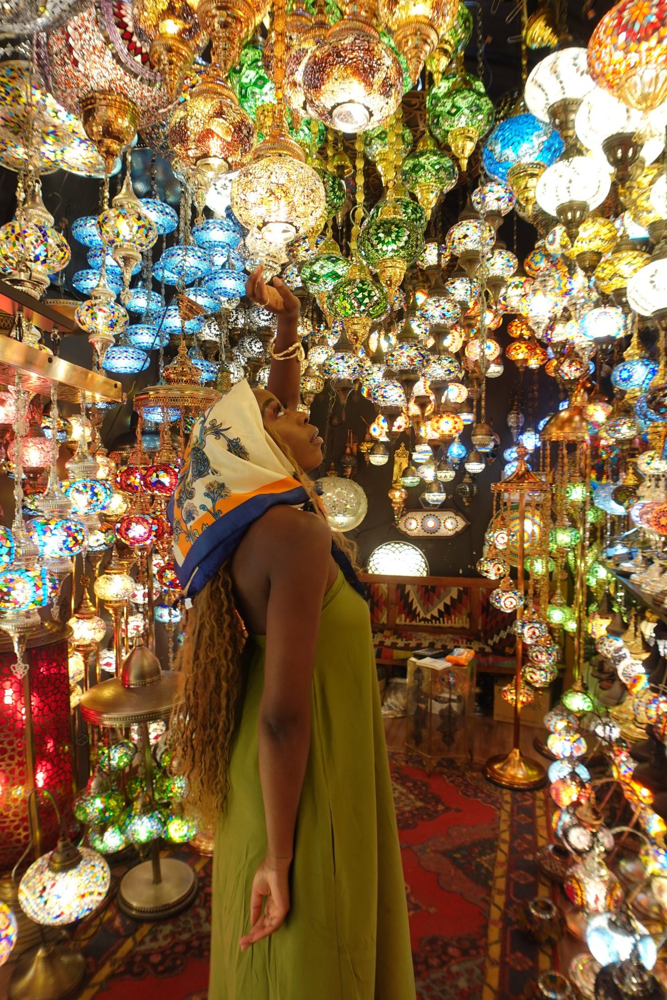 Sandra Zo Awodele in a lantern-filled market