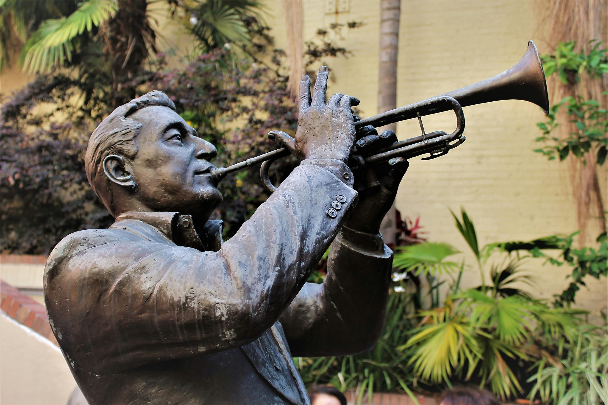 Close-up of a bronze statue of a trumpeter in New Orleans, showcasing musical heritage.