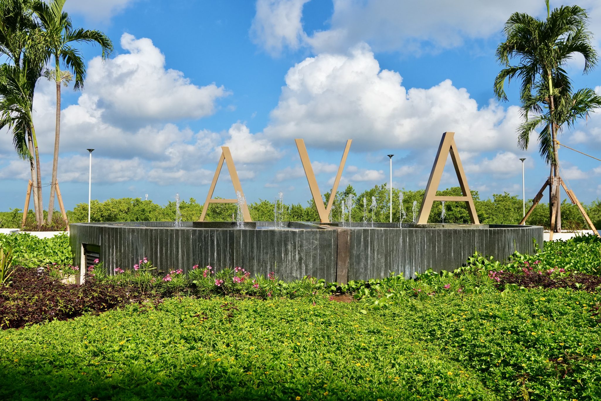 A sign in front of the AVA resort with blue skies in the background