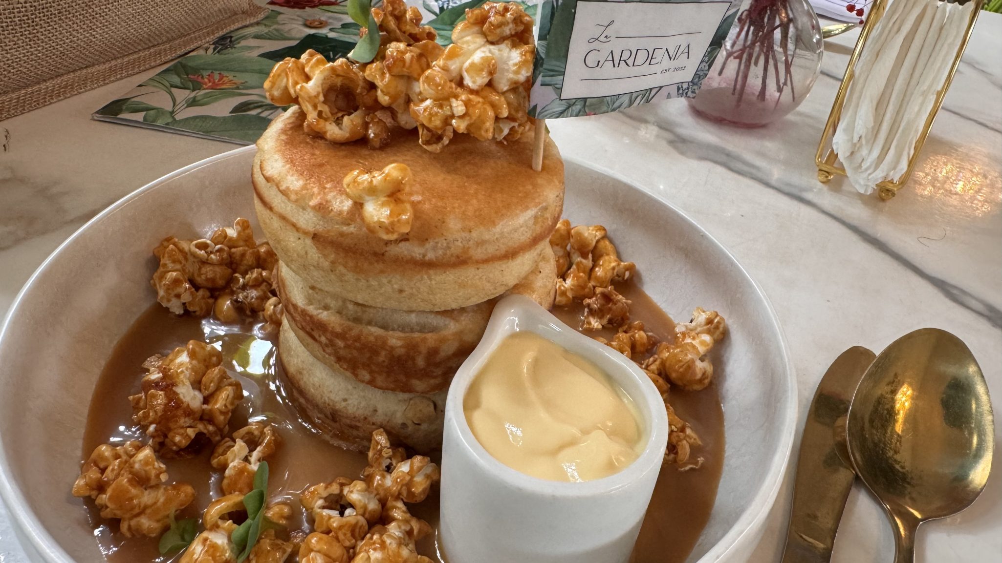 Fluffy pancake with cramelized popcorn and syrup in Ghana restaurant 
